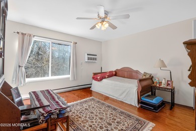 Quiet, private second-floor Navesink model set among the trees on Shadow Lake Village in New Jersey - for sale on GolfHomes.com, golf home, golf lot