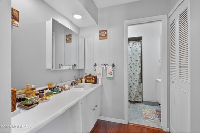 Quiet, private second-floor Navesink model set among the trees on Shadow Lake Village in New Jersey - for sale on GolfHomes.com, golf home, golf lot