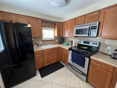 Step into the epitome of easy living in the heart of the popular on Palm Hill Golf Club in Florida - for sale on GolfHomes.com, golf home, golf lot