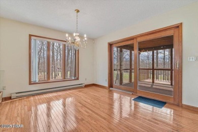 Stunning Cedar Chalet on the 15th Fairway of Paupack Hills in on Paupack Hills Golf and Country Club in Pennsylvania - for sale on GolfHomes.com, golf home, golf lot