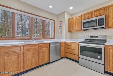 Stunning Cedar Chalet on the 15th Fairway of Paupack Hills in on Paupack Hills Golf and Country Club in Pennsylvania - for sale on GolfHomes.com, golf home, golf lot