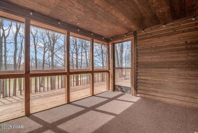 Stunning Cedar Chalet on the 15th Fairway of Paupack Hills in on Paupack Hills Golf and Country Club in Pennsylvania - for sale on GolfHomes.com, golf home, golf lot