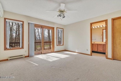 Stunning Cedar Chalet on the 15th Fairway of Paupack Hills in on Paupack Hills Golf and Country Club in Pennsylvania - for sale on GolfHomes.com, golf home, golf lot