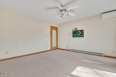 Stunning Cedar Chalet on the 15th Fairway of Paupack Hills in on Paupack Hills Golf and Country Club in Pennsylvania - for sale on GolfHomes.com, golf home, golf lot