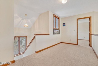 Stunning Cedar Chalet on the 15th Fairway of Paupack Hills in on Paupack Hills Golf and Country Club in Pennsylvania - for sale on GolfHomes.com, golf home, golf lot