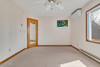 Stunning Cedar Chalet on the 15th Fairway of Paupack Hills in on Paupack Hills Golf and Country Club in Pennsylvania - for sale on GolfHomes.com, golf home, golf lot