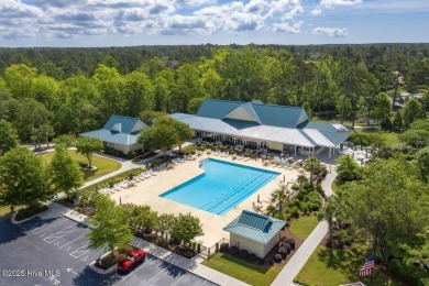 Discover the epitome of comfort and style in this stunning on Carolina National Golf Club in North Carolina - for sale on GolfHomes.com, golf home, golf lot