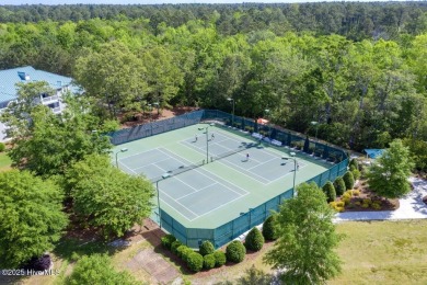 Discover the epitome of comfort and style in this stunning on Carolina National Golf Club in North Carolina - for sale on GolfHomes.com, golf home, golf lot