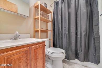 Stunning Cedar Chalet on the 15th Fairway of Paupack Hills in on Paupack Hills Golf and Country Club in Pennsylvania - for sale on GolfHomes.com, golf home, golf lot