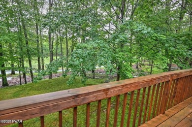 Stunning Cedar Chalet on the 15th Fairway of Paupack Hills in on Paupack Hills Golf and Country Club in Pennsylvania - for sale on GolfHomes.com, golf home, golf lot