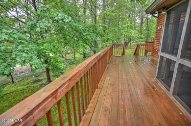 Stunning Cedar Chalet on the 15th Fairway of Paupack Hills in on Paupack Hills Golf and Country Club in Pennsylvania - for sale on GolfHomes.com, golf home, golf lot