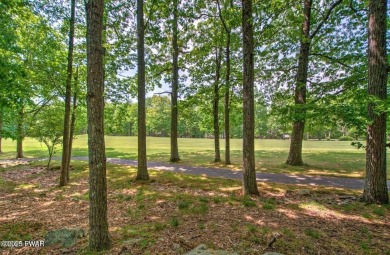 Stunning Cedar Chalet on the 15th Fairway of Paupack Hills in on Paupack Hills Golf and Country Club in Pennsylvania - for sale on GolfHomes.com, golf home, golf lot