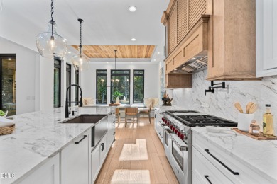 Elegant Modern Style home with views of a forested backyard and on The Preserve At Jordan Lake Golf Club in North Carolina - for sale on GolfHomes.com, golf home, golf lot