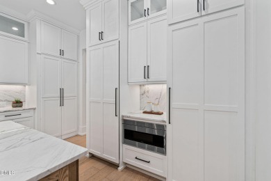 Elegant Modern Style home with views of a forested backyard and on The Preserve At Jordan Lake Golf Club in North Carolina - for sale on GolfHomes.com, golf home, golf lot