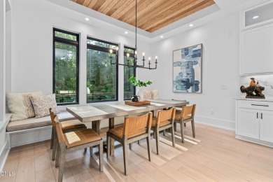Elegant Modern Style home with views of a forested backyard and on The Preserve At Jordan Lake Golf Club in North Carolina - for sale on GolfHomes.com, golf home, golf lot