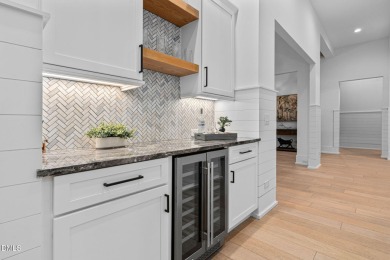 Elegant Modern Style home with views of a forested backyard and on The Preserve At Jordan Lake Golf Club in North Carolina - for sale on GolfHomes.com, golf home, golf lot