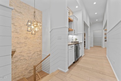 Elegant Modern Style home with views of a forested backyard and on The Preserve At Jordan Lake Golf Club in North Carolina - for sale on GolfHomes.com, golf home, golf lot