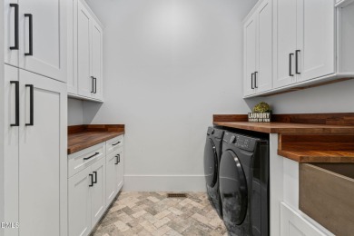 Elegant Modern Style home with views of a forested backyard and on The Preserve At Jordan Lake Golf Club in North Carolina - for sale on GolfHomes.com, golf home, golf lot