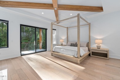 Elegant Modern Style home with views of a forested backyard and on The Preserve At Jordan Lake Golf Club in North Carolina - for sale on GolfHomes.com, golf home, golf lot