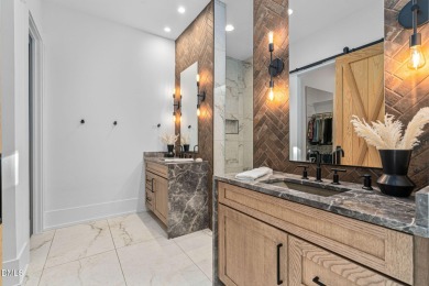 Elegant Modern Style home with views of a forested backyard and on The Preserve At Jordan Lake Golf Club in North Carolina - for sale on GolfHomes.com, golf home, golf lot