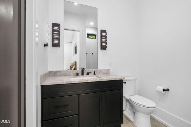 Elegant Modern Style home with views of a forested backyard and on The Preserve At Jordan Lake Golf Club in North Carolina - for sale on GolfHomes.com, golf home, golf lot