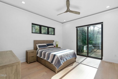 Elegant Modern Style home with views of a forested backyard and on The Preserve At Jordan Lake Golf Club in North Carolina - for sale on GolfHomes.com, golf home, golf lot