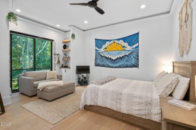 Elegant Modern Style home with views of a forested backyard and on The Preserve At Jordan Lake Golf Club in North Carolina - for sale on GolfHomes.com, golf home, golf lot