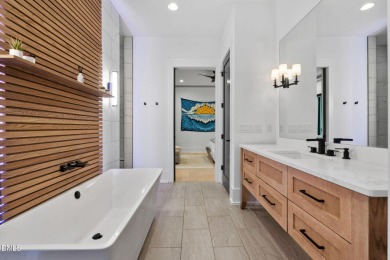 Elegant Modern Style home with views of a forested backyard and on The Preserve At Jordan Lake Golf Club in North Carolina - for sale on GolfHomes.com, golf home, golf lot