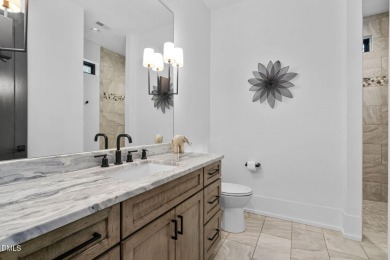 Elegant Modern Style home with views of a forested backyard and on The Preserve At Jordan Lake Golf Club in North Carolina - for sale on GolfHomes.com, golf home, golf lot
