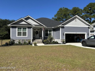 This home was built in 2024; it's practically brand new! The on Harbour Point Golf Club in North Carolina - for sale on GolfHomes.com, golf home, golf lot