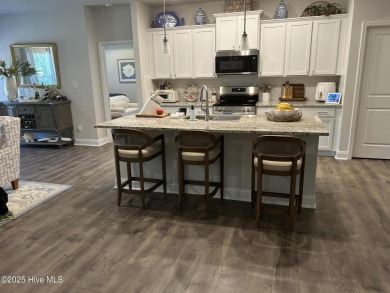 This home was built in 2024; it's practically brand new! The on Harbour Point Golf Club in North Carolina - for sale on GolfHomes.com, golf home, golf lot