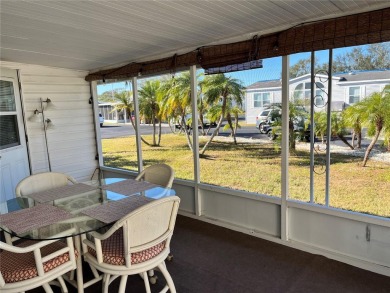 This 2 bedroom 1 1/2 bath home has a screened in porch and on Mangrove Bay Golf Course in Florida - for sale on GolfHomes.com, golf home, golf lot