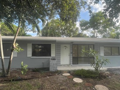 Charming 3 bedrooms, 2 baths home with a versatile den in on Pompano Beach Golf Course  in Florida - for sale on GolfHomes.com, golf home, golf lot