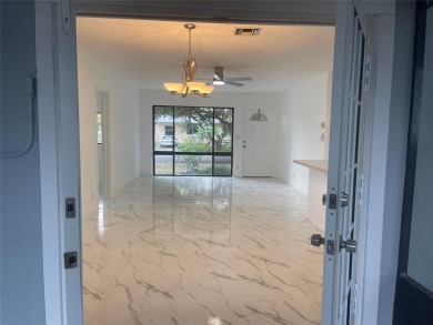 Charming 3 bedrooms, 2 baths home with a versatile den in on Pompano Beach Golf Course  in Florida - for sale on GolfHomes.com, golf home, golf lot