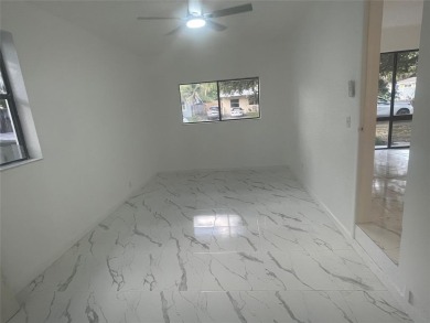 Charming 3 bedrooms, 2 baths home with a versatile den in on Pompano Beach Golf Course  in Florida - for sale on GolfHomes.com, golf home, golf lot