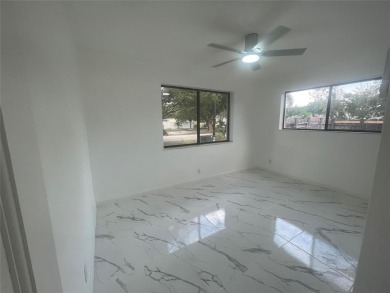 Charming 3 bedrooms, 2 baths home with a versatile den in on Pompano Beach Golf Course  in Florida - for sale on GolfHomes.com, golf home, golf lot