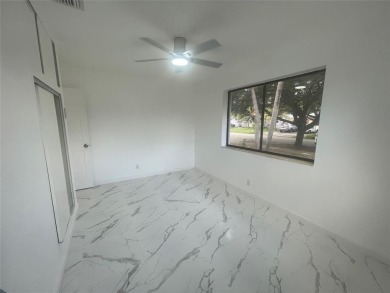 Charming 3 bedrooms, 2 baths home with a versatile den in on Pompano Beach Golf Course  in Florida - for sale on GolfHomes.com, golf home, golf lot