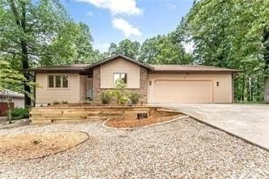 Tucked in Dunvegan near Loch Lomond, this refreshed single-level on Bella Vista Country Club - Scottsdale in Arkansas - for sale on GolfHomes.com, golf home, golf lot