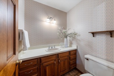 Welcome to this charming and spacious home nestled on nearly an on North Shore Country Club in Wisconsin - for sale on GolfHomes.com, golf home, golf lot