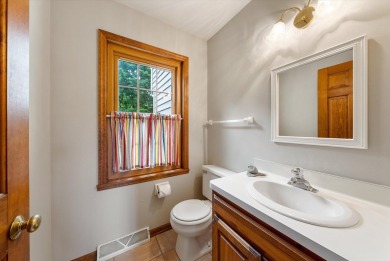 Welcome to this charming and spacious home nestled on nearly an on North Shore Country Club in Wisconsin - for sale on GolfHomes.com, golf home, golf lot