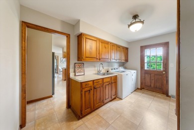 Welcome to this charming and spacious home nestled on nearly an on North Shore Country Club in Wisconsin - for sale on GolfHomes.com, golf home, golf lot