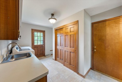 Welcome to this charming and spacious home nestled on nearly an on North Shore Country Club in Wisconsin - for sale on GolfHomes.com, golf home, golf lot