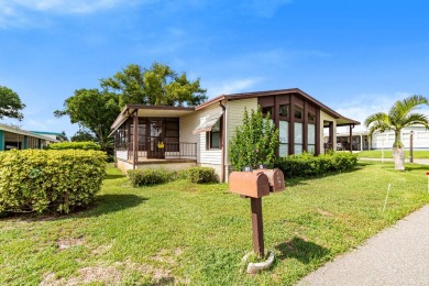 Discover a charming 2-bedroom, 2-bathroom home in the Swiss on Lake Henry Golf Club in Florida - for sale on GolfHomes.com, golf home, golf lot