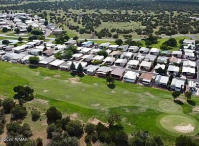 This home is situated in Juniper Ridge Resort (JRR) a 55+ adult on Juniper Ridge R.V. Golf Resort in Arizona - for sale on GolfHomes.com, golf home, golf lot