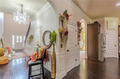 Discover this beautifully designed 4-sided brick home tucked on Crystal Lake Golf and Country Club in Georgia - for sale on GolfHomes.com, golf home, golf lot