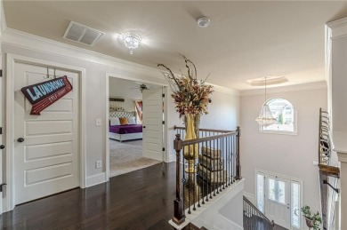 Discover this beautifully designed 4-sided brick home tucked on Crystal Lake Golf and Country Club in Georgia - for sale on GolfHomes.com, golf home, golf lot