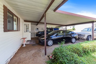 Discover a charming 2-bedroom, 2-bathroom home in the Swiss on Lake Henry Golf Club in Florida - for sale on GolfHomes.com, golf home, golf lot