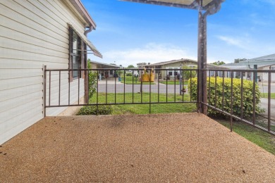 Discover a charming 2-bedroom, 2-bathroom home in the Swiss on Lake Henry Golf Club in Florida - for sale on GolfHomes.com, golf home, golf lot