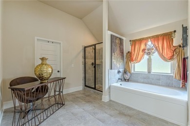 Discover this beautifully designed 4-sided brick home tucked on Crystal Lake Golf and Country Club in Georgia - for sale on GolfHomes.com, golf home, golf lot
