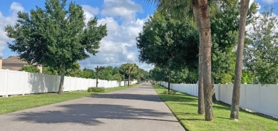 Discover a charming 2-bedroom, 2-bathroom home in the Swiss on Lake Henry Golf Club in Florida - for sale on GolfHomes.com, golf home, golf lot